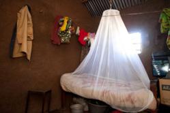 Nuru International Kenya: treated bed net to prevent malaria. World Malaria Day